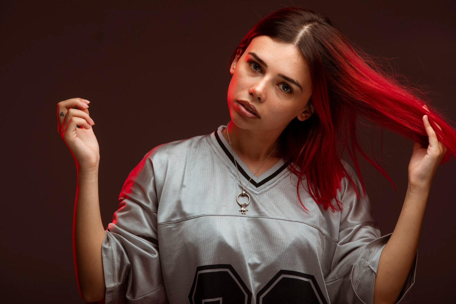 Subtle Red Peekaboo Highlights for a Modern Vamp Touch