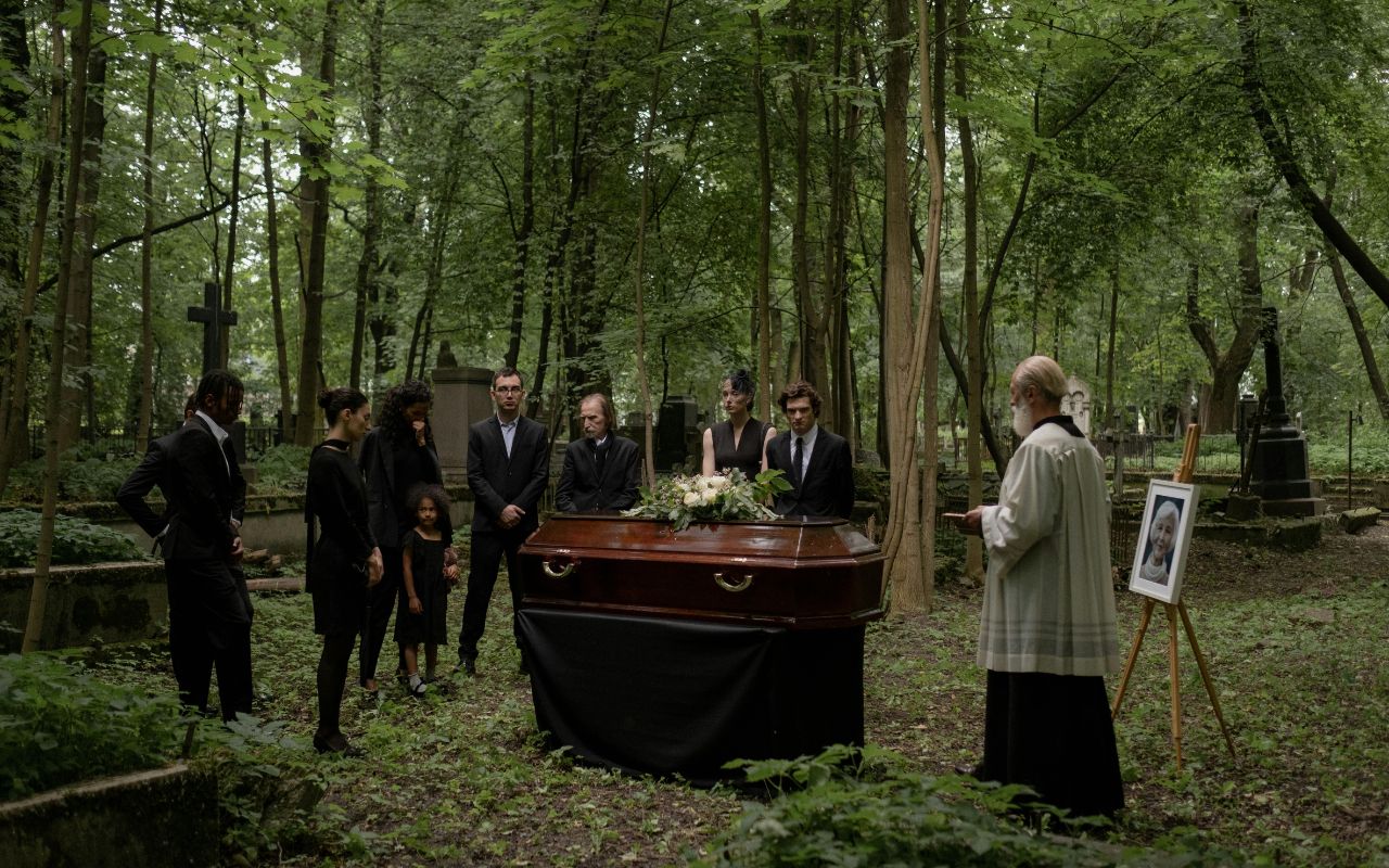 Licensed funeral staff preparing a casket, illustrating legal procedures for human burials.