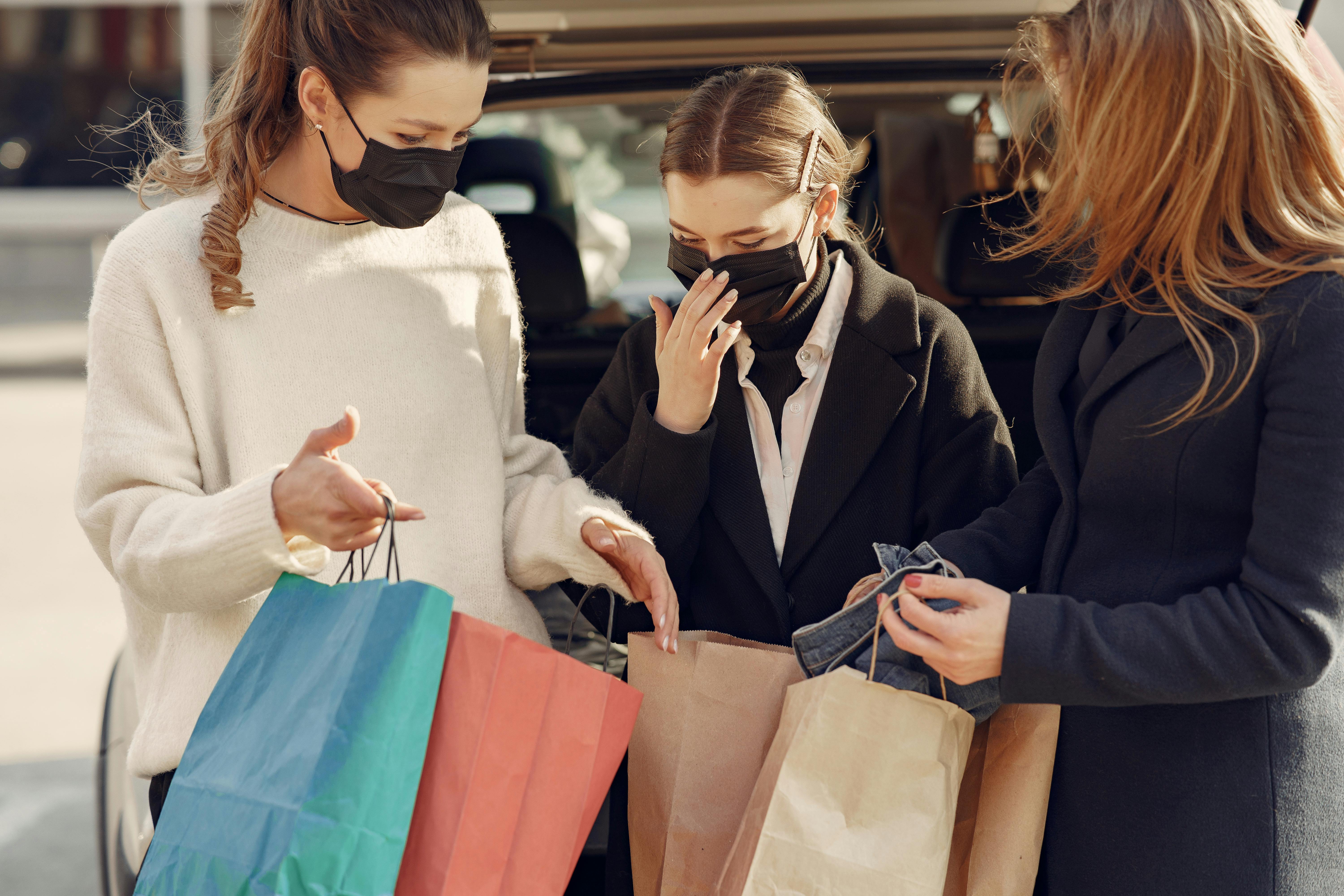 Shopper reading the ingredient list on a Trader Joe’s product to spot changes.