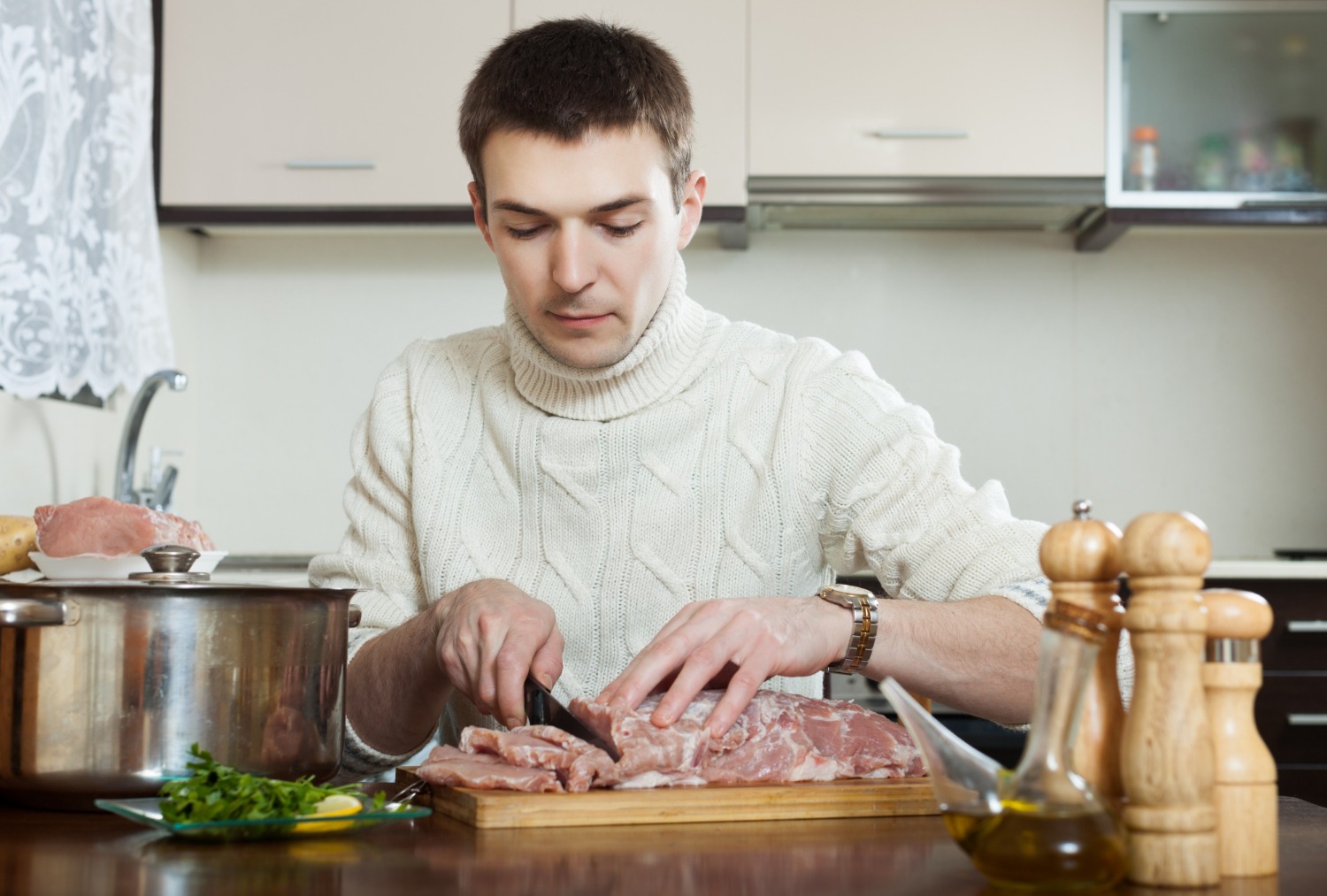 Home cook handling steak excessively before cooking