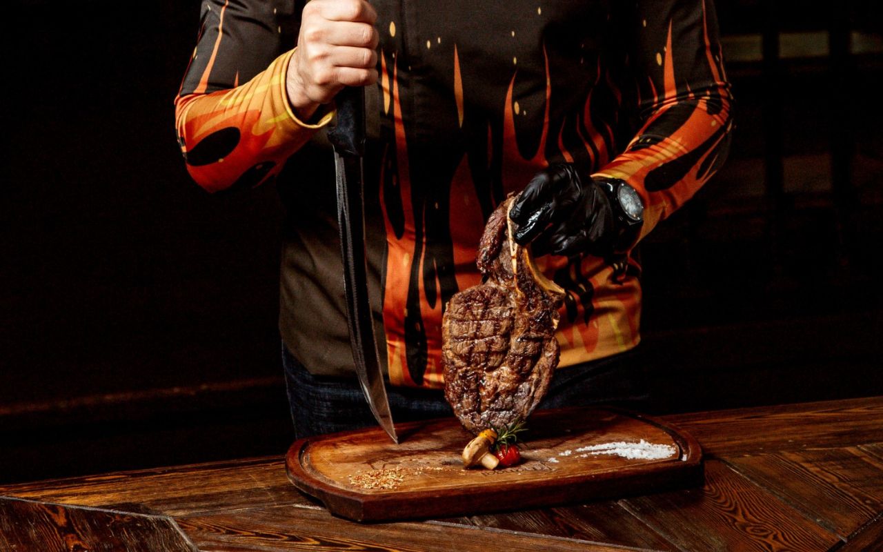 Raw steak left out on countertop too long, showing risk of uneven cooking and safety concerns.