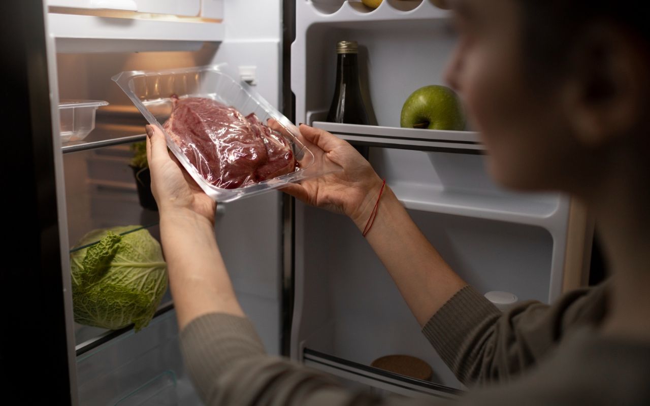 Cold steak being placed on a hot skillet