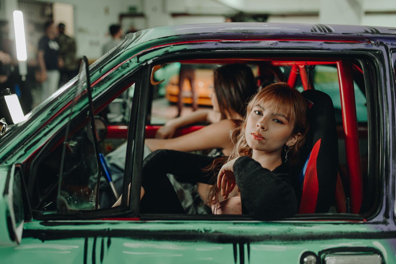 Vintage car interior showing a family without seatbelts.