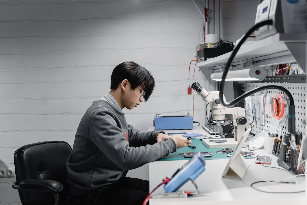 IT technician diagnosing Windows 11 PC issues using professional diagnostic tools.