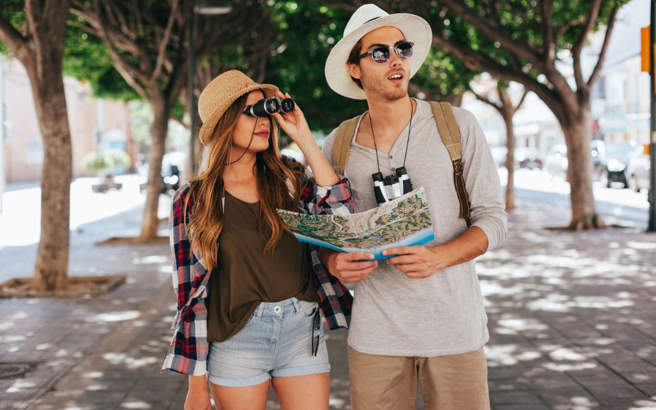 Tourists photographing small details in a European city while locals move by unnoticedg