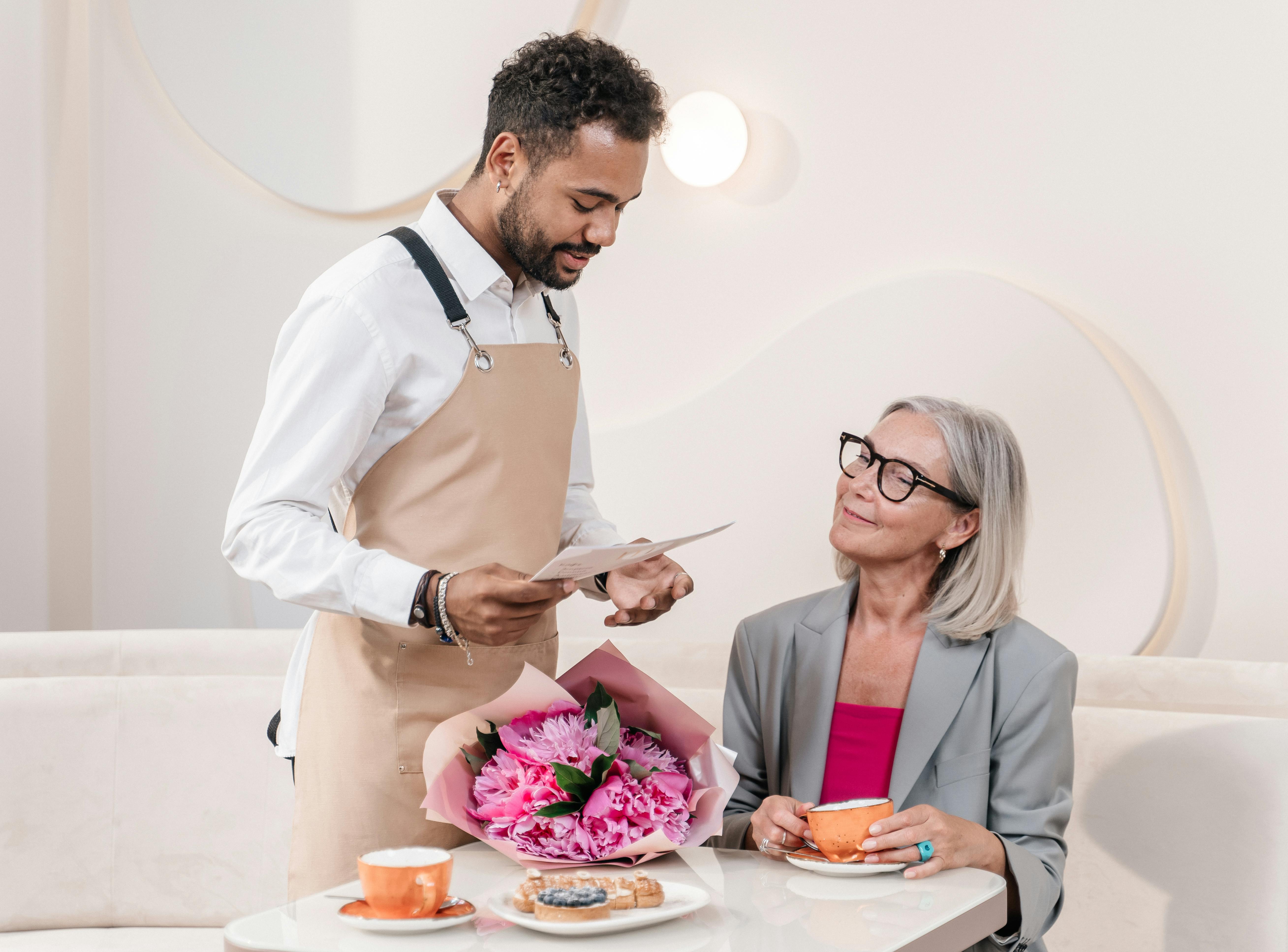 American tourist leaving a large tip in a European restaurant while the server looks surprised