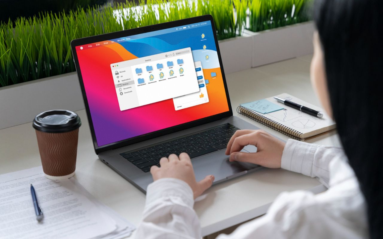 Windows 11 laptop displaying a one-click performance fix program pop-up on desktop.