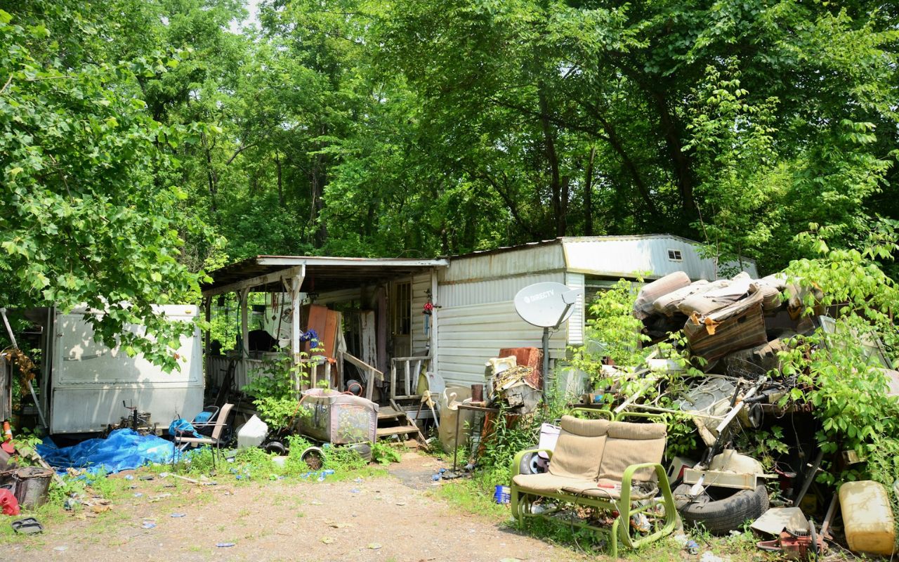 Construction debris and household junk at a licensed disposal site, showing safe and legal handling