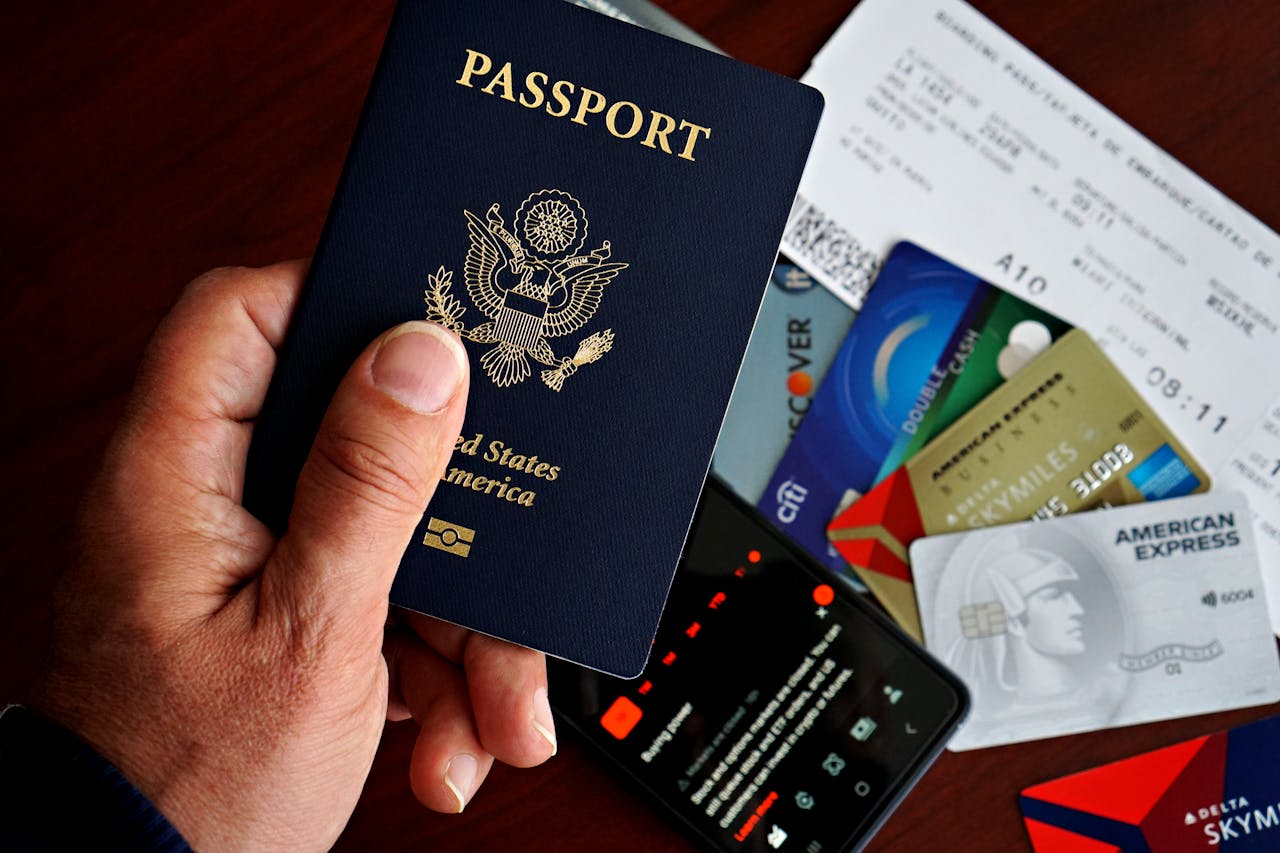 traveler holding passport airport departure board